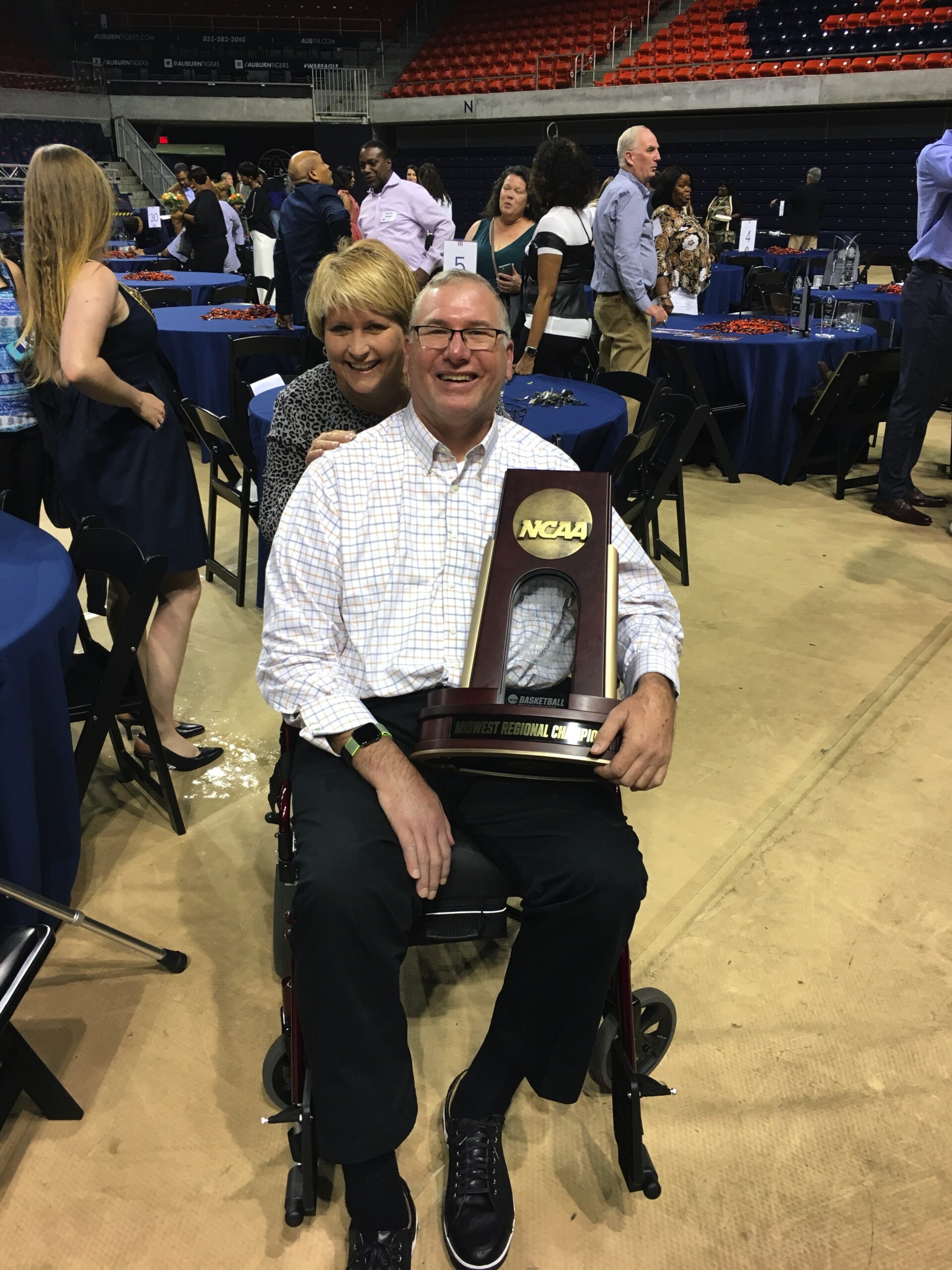 Carol and Gary Godfrey with NCAA midwest regional championship trophy